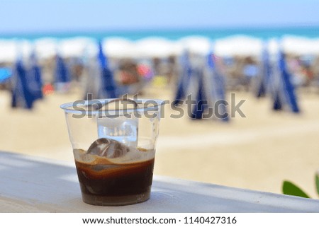 Black ice coffee on the beach