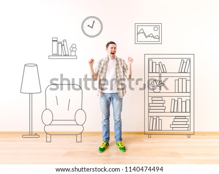 Photo of screaming young man with painted on wall shelving, picture, clock, armchair, floor lamp