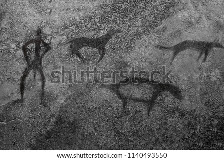 An image of ancient animals and a man on a cave wall. ancient history, archeology.