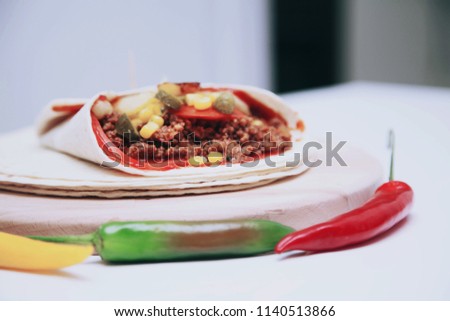 Ingredients for preparing mexican food, tortilla with meat and vegetables