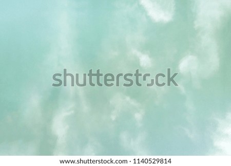 Texture of water with reflected clouds