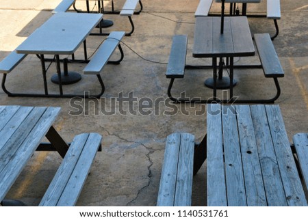 Picnic tables at an outdoor eating area. 