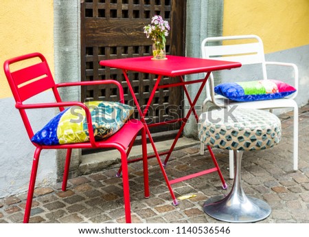 table and chair at a sidewalk cafe