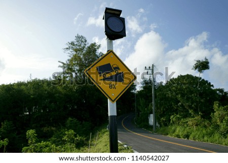 Steep uphill warning sign                              