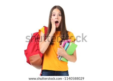 Young girl with backpack and books on white background