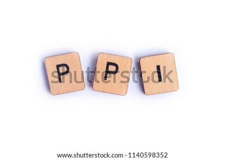The abbreviation PPI - Payment Protection Insurance - spelt with wooden letter tiles.