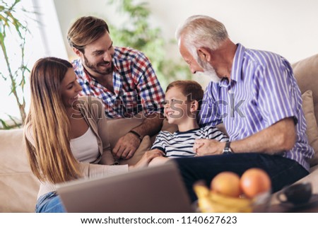 Portrait of a three generation family spending time together at home Royalty-Free Stock Photo #1140627623