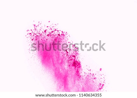 Pink powder explosion on white background. Paint Holi. Colored powder splatted.