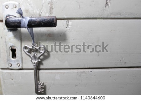 key with hope on a door handle Royalty-Free Stock Photo #1140644600