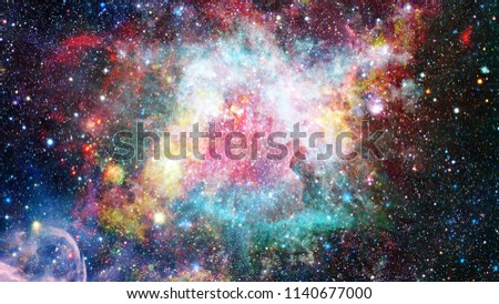Colored clouds in nebula. Combined version of Hubble space telescope image. Elements of this image furnished by NASA.