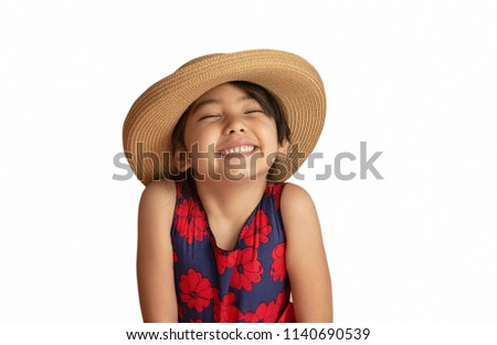 a portrait of happy little girl wearing hat isolated on white background 
