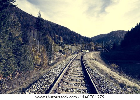 Railway tracks in autumn time in Slovakia. Coloring in a vintage atmosphere.