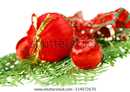 Red Christmas balls composition on green thuja branch