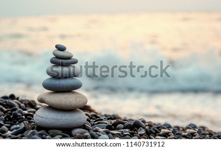 made of stone tower on the beach and blur background Royalty-Free Stock Photo #1140731912