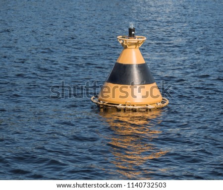 Warning vessel striped buoy in the water