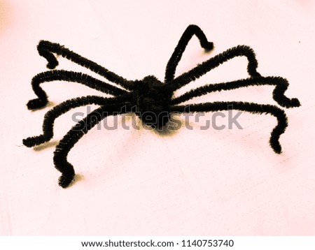 handmade toy spider with orange background
