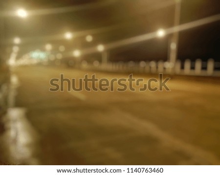 Blurry image,The image of a silent street And the electricity is shining in the night,need blur picture