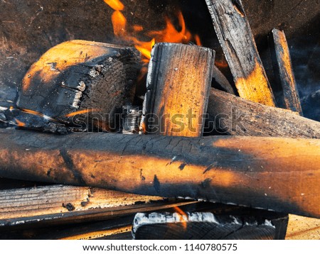 Burning wood in the grill