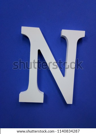 White Letter N On Blue Background