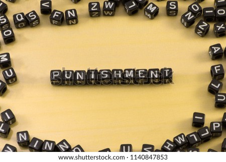 The word punishment on wood background