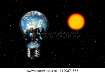 Light bulb with world inside and global warming isolated on black"Elements of this image furnished by NASA "