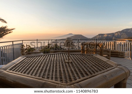  Table on the terrace overlooking the Bay of Naples and  Vesuvius. Sorrento. Italy