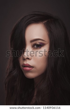 Beauty portrait of asian woman on dark background