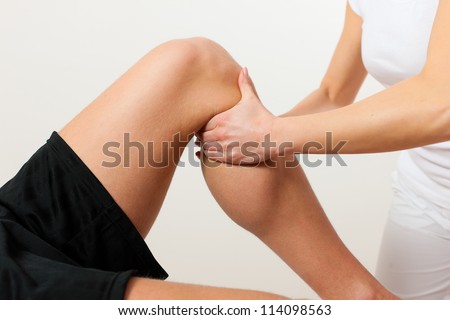 Patient at the physiotherapy doing physical therapy exercises with his therapist Royalty-Free Stock Photo #114098563