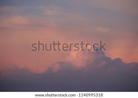 Storm clouds in the evening sky visible from a distance