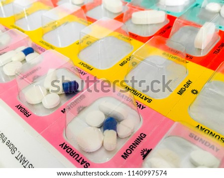 Tablets in a day organised blister pack. Royalty-Free Stock Photo #1140997574