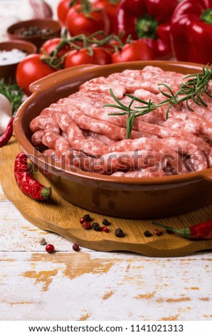 Raw minced meat with red vegetables and spices. Selective focus.