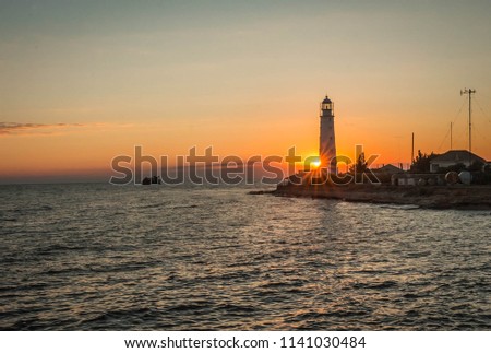 Image of lighthouse at sunset in Olenivka in Crimea in Russia
