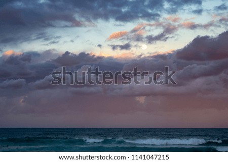 Beautiful sunset at the beach pink and blue colors