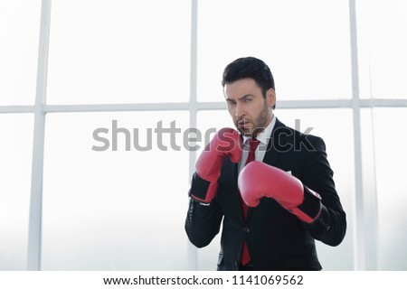 serious businessman in Boxing gloves