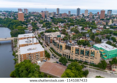 Aerial view of Milwaukee Wisconsin featuring north end of Water Street. Views of downtown, the Milwaukee river along with residential units and commercial buildings.