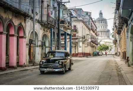 The Capitol, a street in Central Havana, the Old town, a retro car Royalty-Free Stock Photo #1141100972