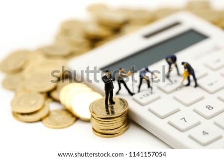 Miniature people : worker and box with  coins  and Calculator of tax,shipping, rent container, business concept.