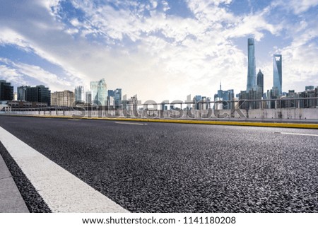 empty asphalt road with modern office building in shanghai china