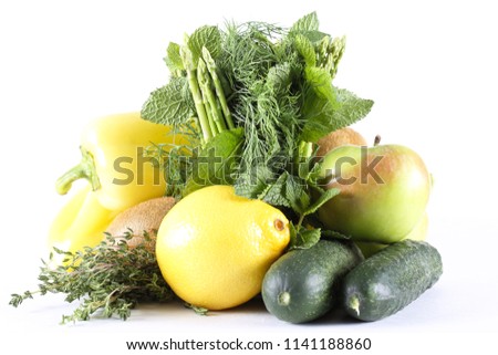 asparagus fresh and other vegetables are lying on a white background