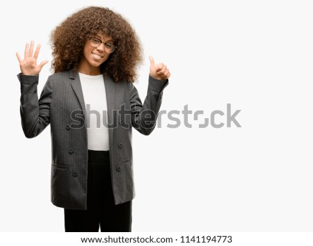 African american business woman wearing glasses showing and pointing up with fingers number six while smiling confident and happy.