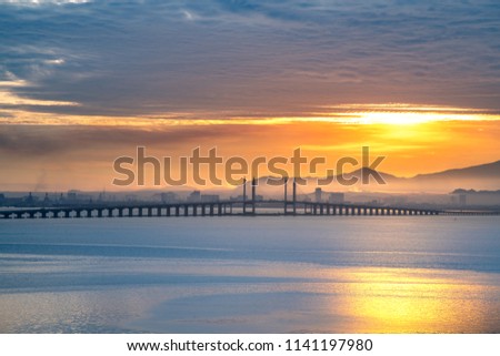 Morning view of penang bridge 1 , sunrise at Penang Island, Travel Malaysia , waterside view landscape, Industrial city Royalty-Free Stock Photo #1141197980