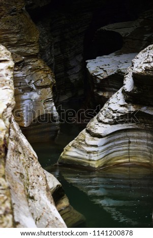 Geological site of Brent de l'Art: canyons carved into the rock by the river Ardo, in Valbelluna, Belluno, Italy. Royalty-Free Stock Photo #1141200878