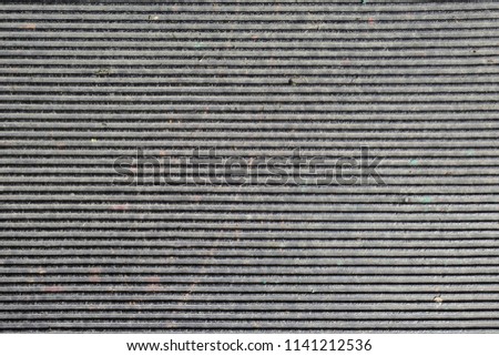 Old dirty rubber, embossed stripes