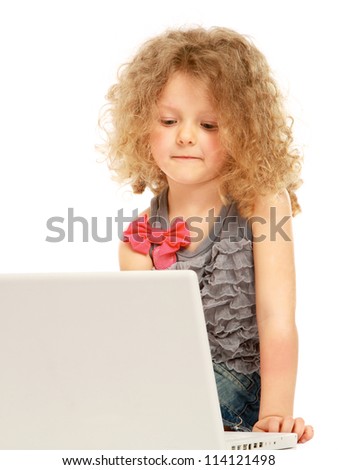 A little girl with a laptop, isolated on white background