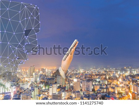 Face scan of phone Machine learning systems accurate biometric technology and artificial intelligence concept city background.