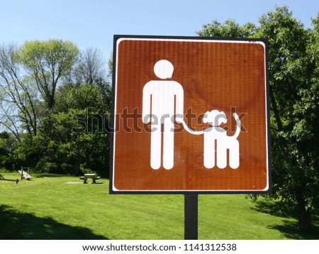 A notice in a park advising people must have dogs on a lead                          