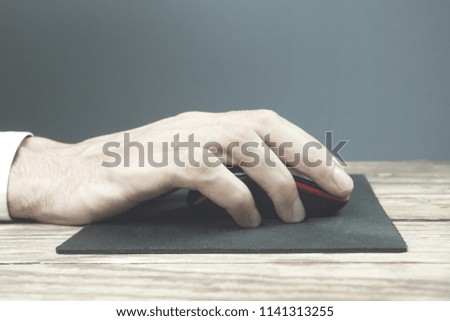 Contemporary looking guy working with computer