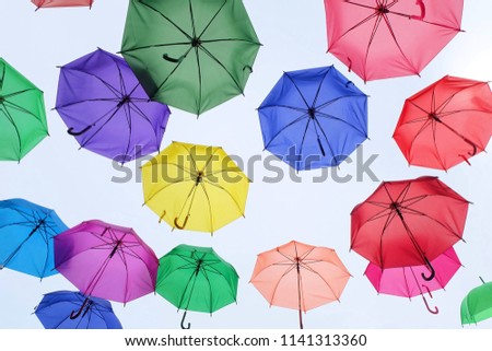 An umbrella a beautiful design conceptual good decorative art color red green blue yellow pink multicolored weather protect rainy spring 