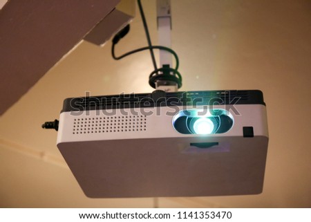 Multimedia projector installed on the ceiling.