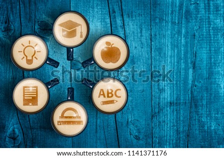Coffee cups with different icon symbols depicting the idea of education. Back to school concept.